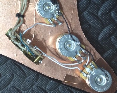 View of Fender Strat wiring from selector switch to pots with conductive shielded pickguard