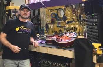 Guitar repair shop owner Jim Hobson at Artisan Luthiers' guitar services shop in Kennesaw GA